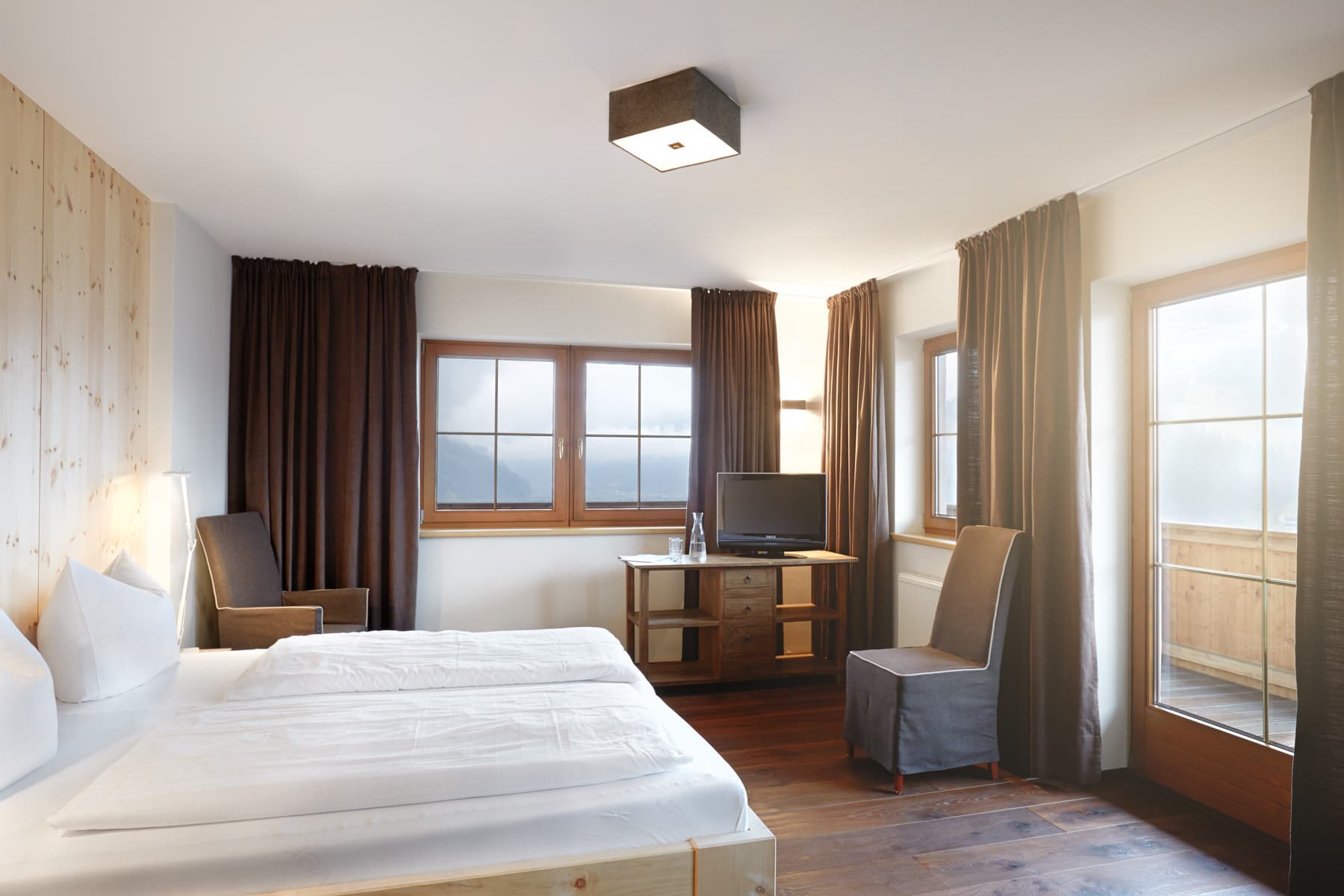 Bedroom with double bed and balcony door